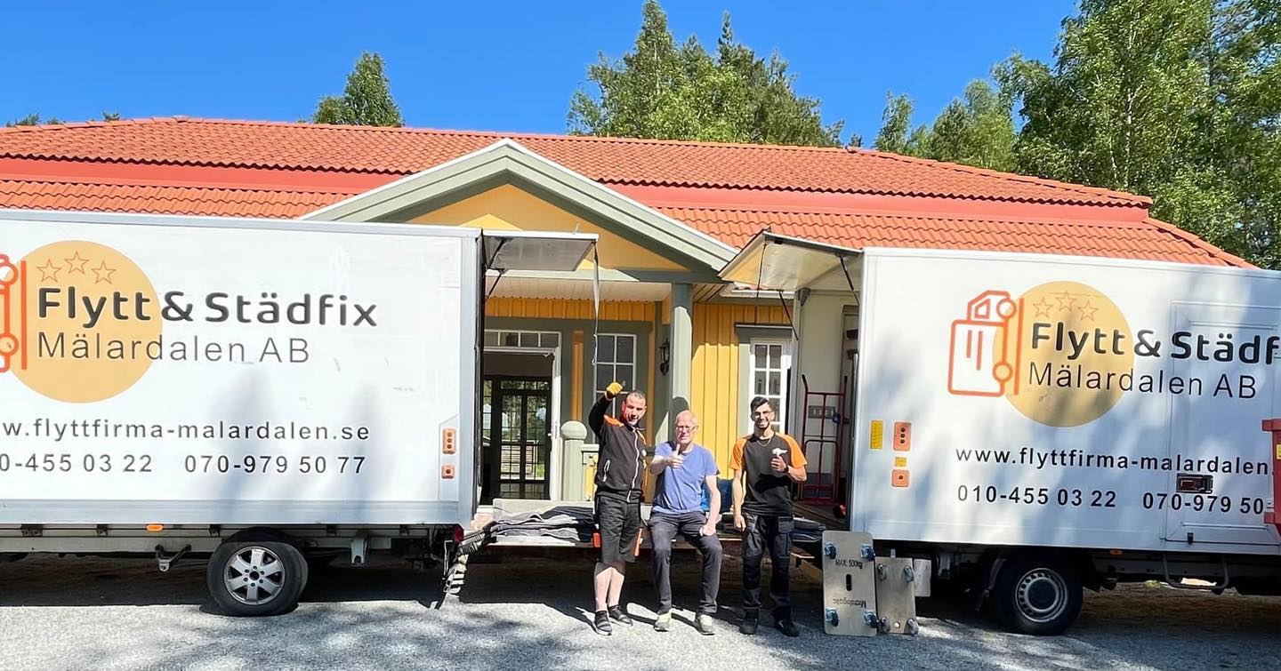 Two removal vans outside a house